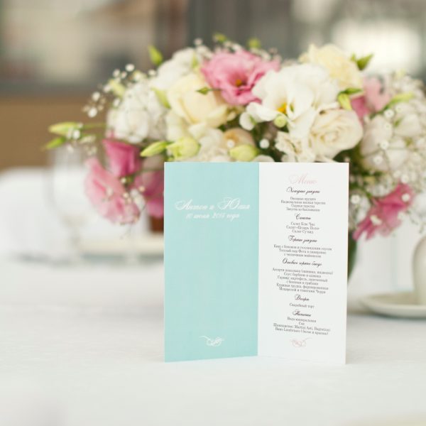 Menu card with beautiful flowers on table in wedding day at Lakeside Weddings