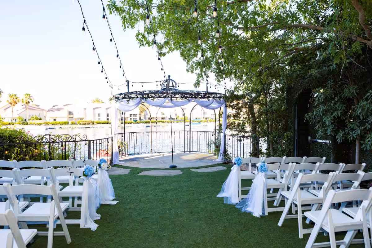Lakeside wedding gazebo with string lights
